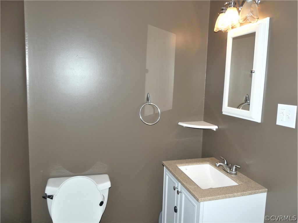 1325 Courthouse Road Chase City, VA 23924 - Photo 34 of 49 a bathroom with a sink mirror and vanity