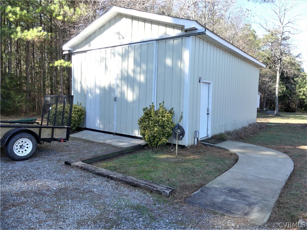 1325 Courthouse Road Chase City, VA 23924 - Photo 38 of 49 a backyard of a house with yard and outdoor seating