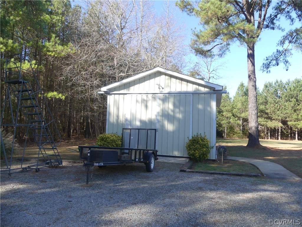 1325 Courthouse Road Chase City, VA 23924 - Photo 39 of 49 a backyard of a house with fountain table and chairs