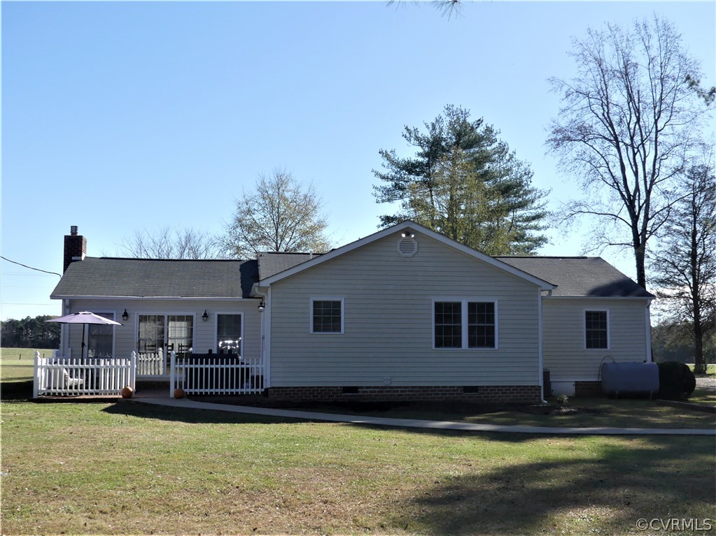 1325 Courthouse Road Chase City, VA 23924 - Photo 7 of 49 a front view of a house with swimming pool and yard