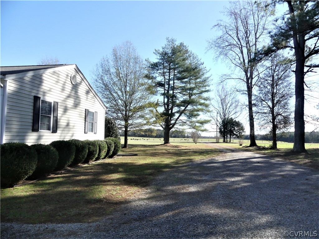 1325 Courthouse Road Chase City, VA 23924 - Photo 8 of 49 a front view of a house with a yard