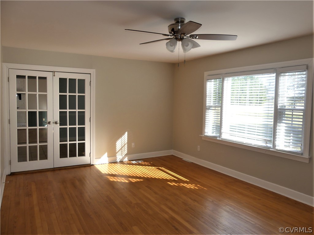 1325 Courthouse Road Chase City, VA 23924 - Photo 10 of 49 a view of an empty room with a window and wooden floor