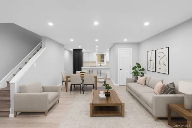 a living room with furniture and a potted plant