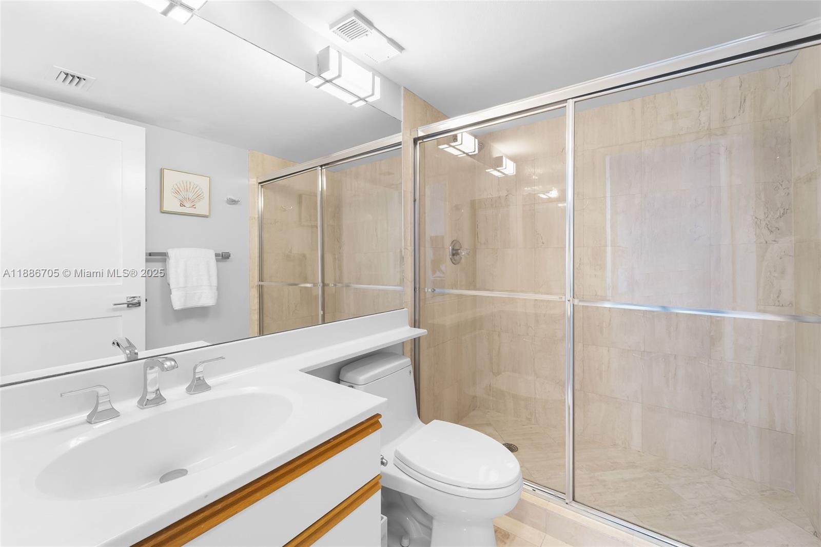 3600 Mystic Pointe Drive, Unit 614 Aventura, FL 33180 - Photo 10 of 14 a bathroom with a sink and a mirror