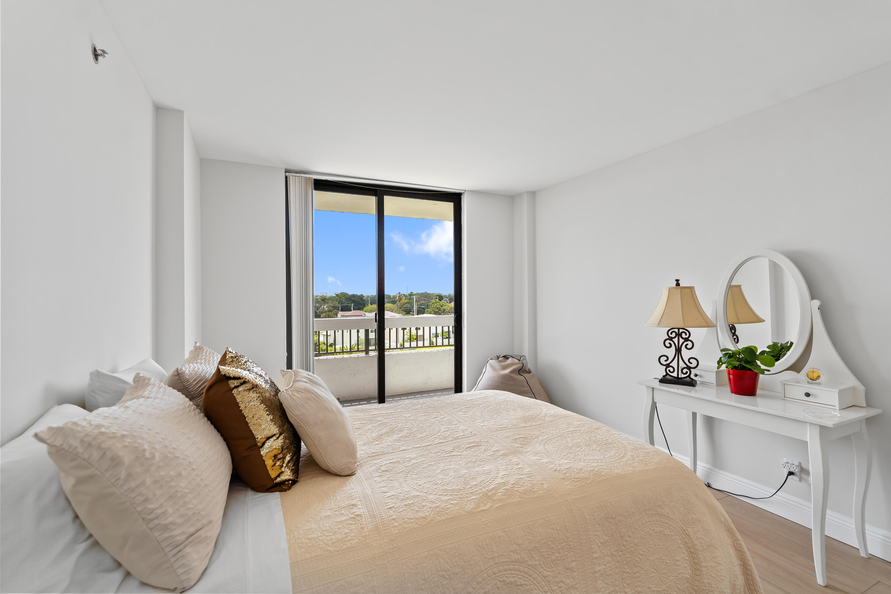 23200 Camino Del Mar, Unit 603 Boca Raton, FL 33433 - Photo 23 of 43 a bedroom with a bed and a large window