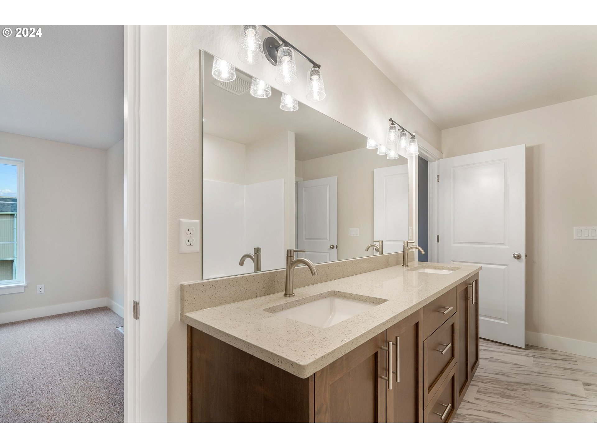 829 Northwest 175th Way Ridgefield, WA 98642 - Photo 11 of 17 a bathroom with a sink a vanity and a mirror