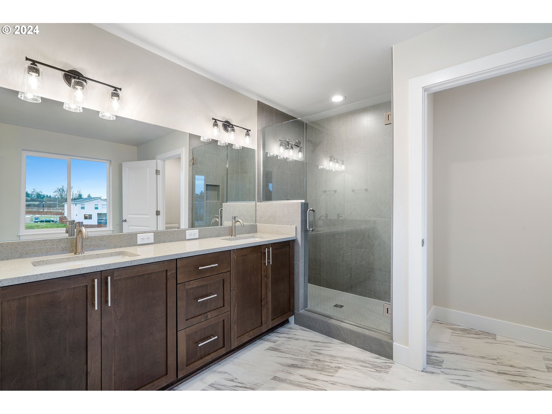 829 Northwest 175th Way Ridgefield, WA 98642 - Photo 17 of 17 a bathroom with a sink and a mirror