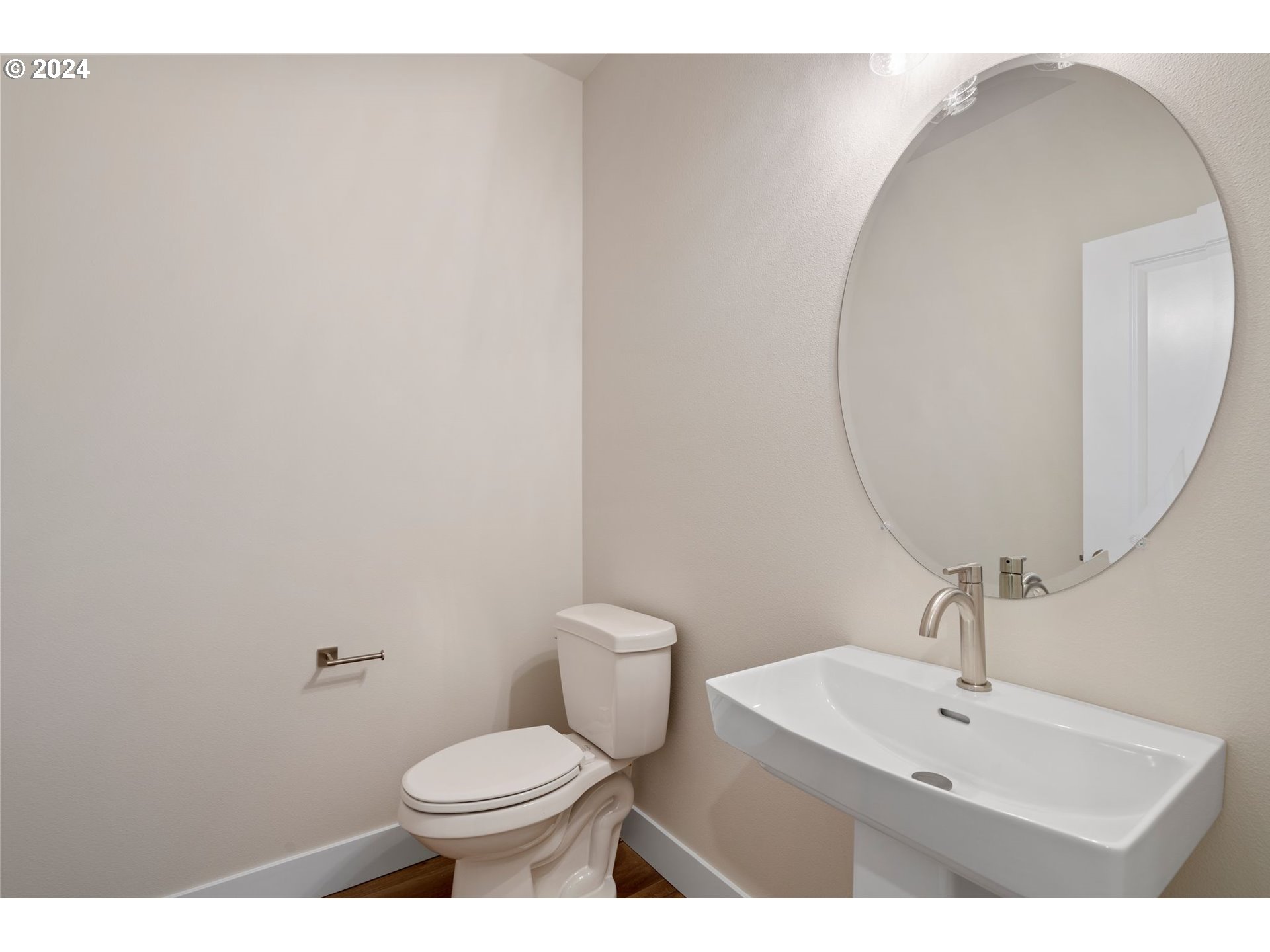 829 Northwest 175th Way Ridgefield, WA 98642 - Photo 2 of 17 a bathroom with a toilet a sink and mirror