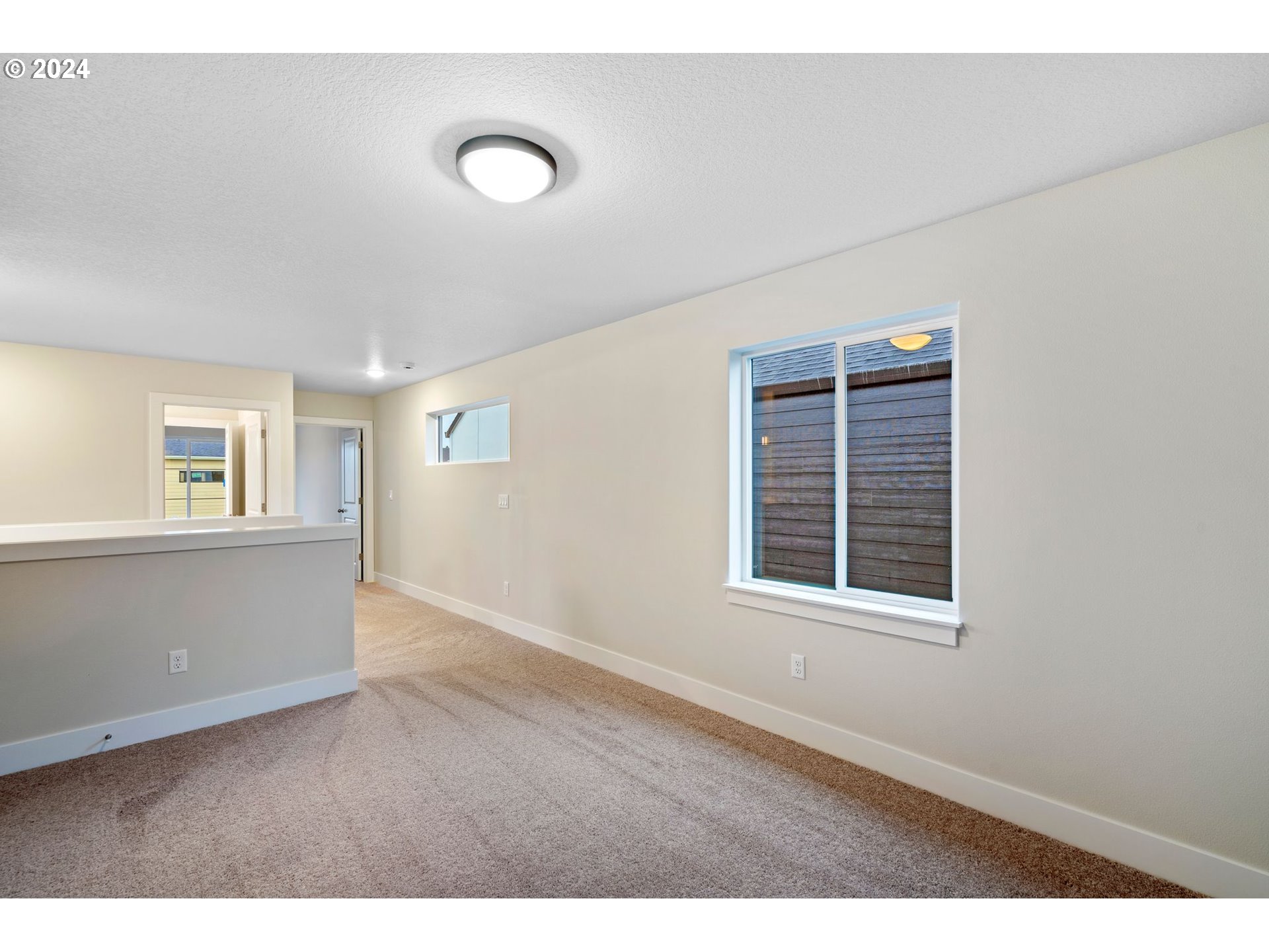 829 Northwest 175th Way Ridgefield, WA 98642 - Photo 8 of 17 a view of an empty room with a window