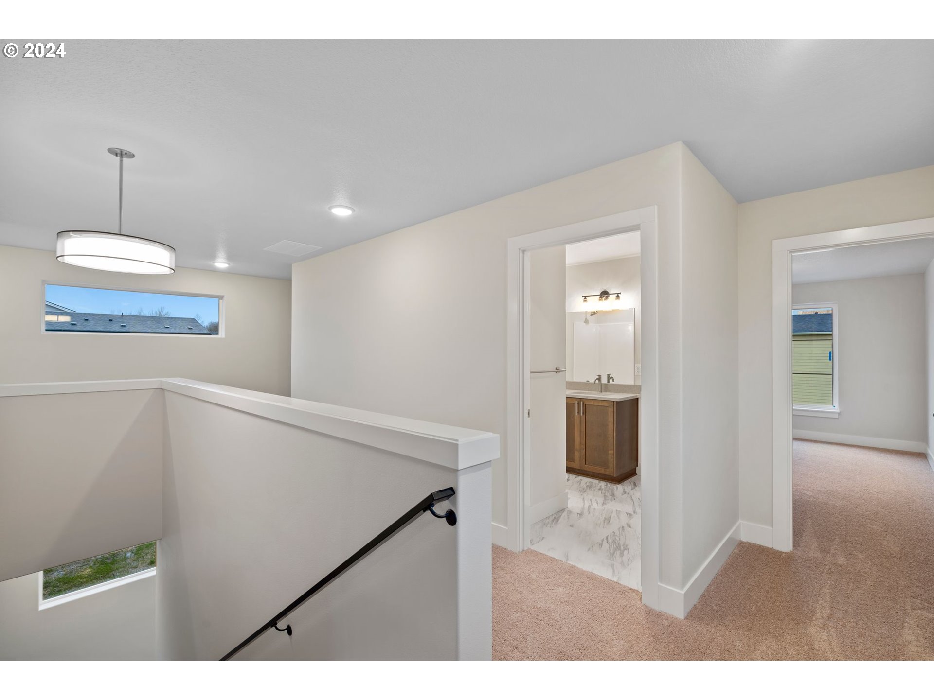 829 Northwest 175th Way Ridgefield, WA 98642 - Photo 9 of 17 a hallway with a large window and chandelier