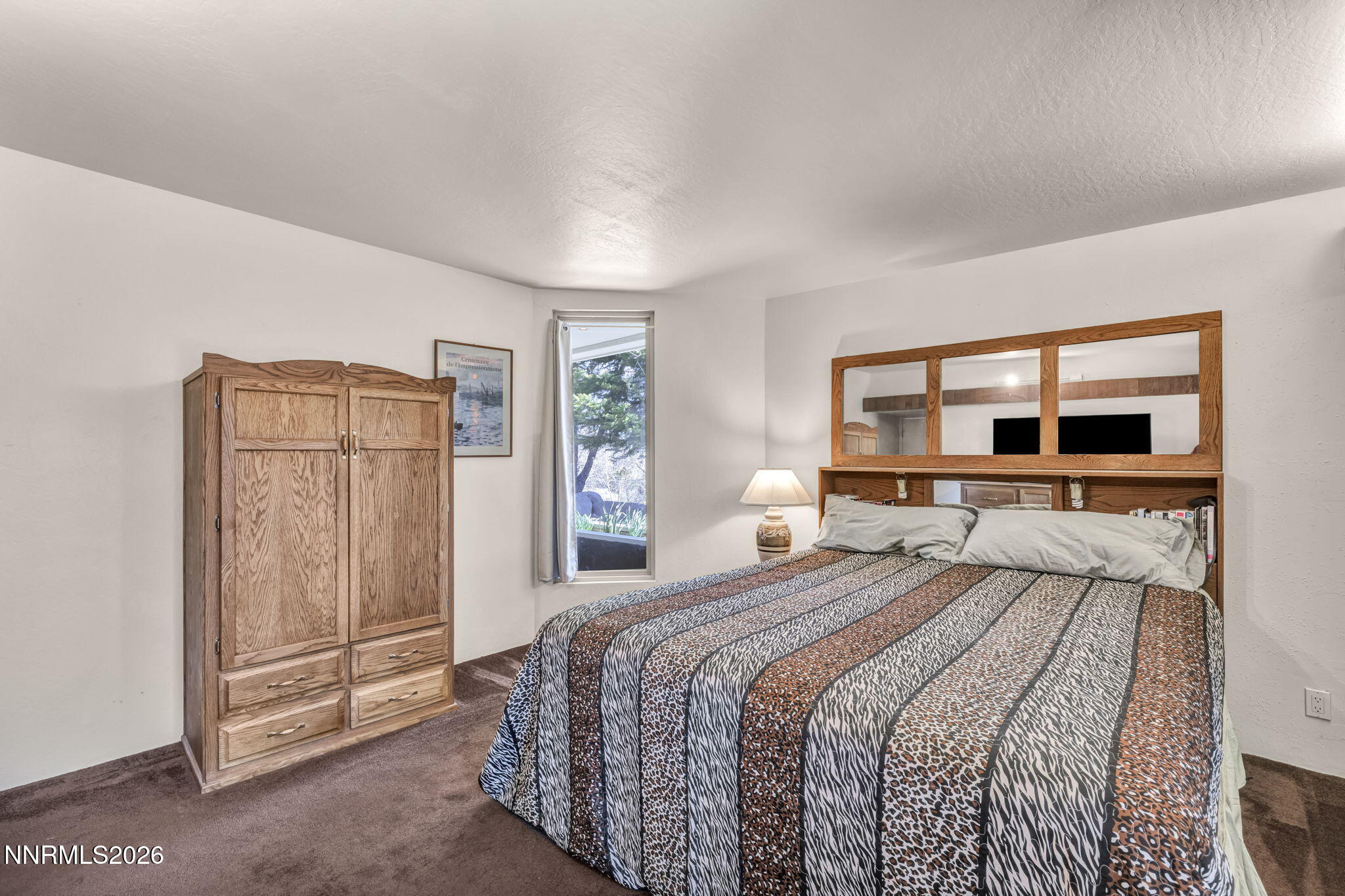 13600 Stoneybrook Drive Reno, NV 89511 - Photo 103 of 120 a bedroom with a large bed and a window