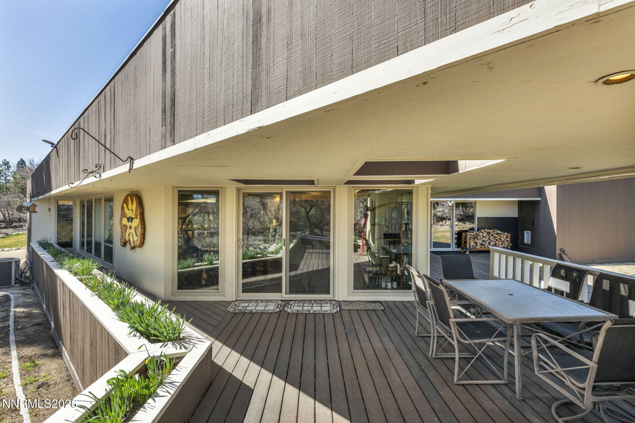13600 Stoneybrook Drive Reno, NV 89511 - Photo 21 of 120 a balcony with furniture and wooden floor