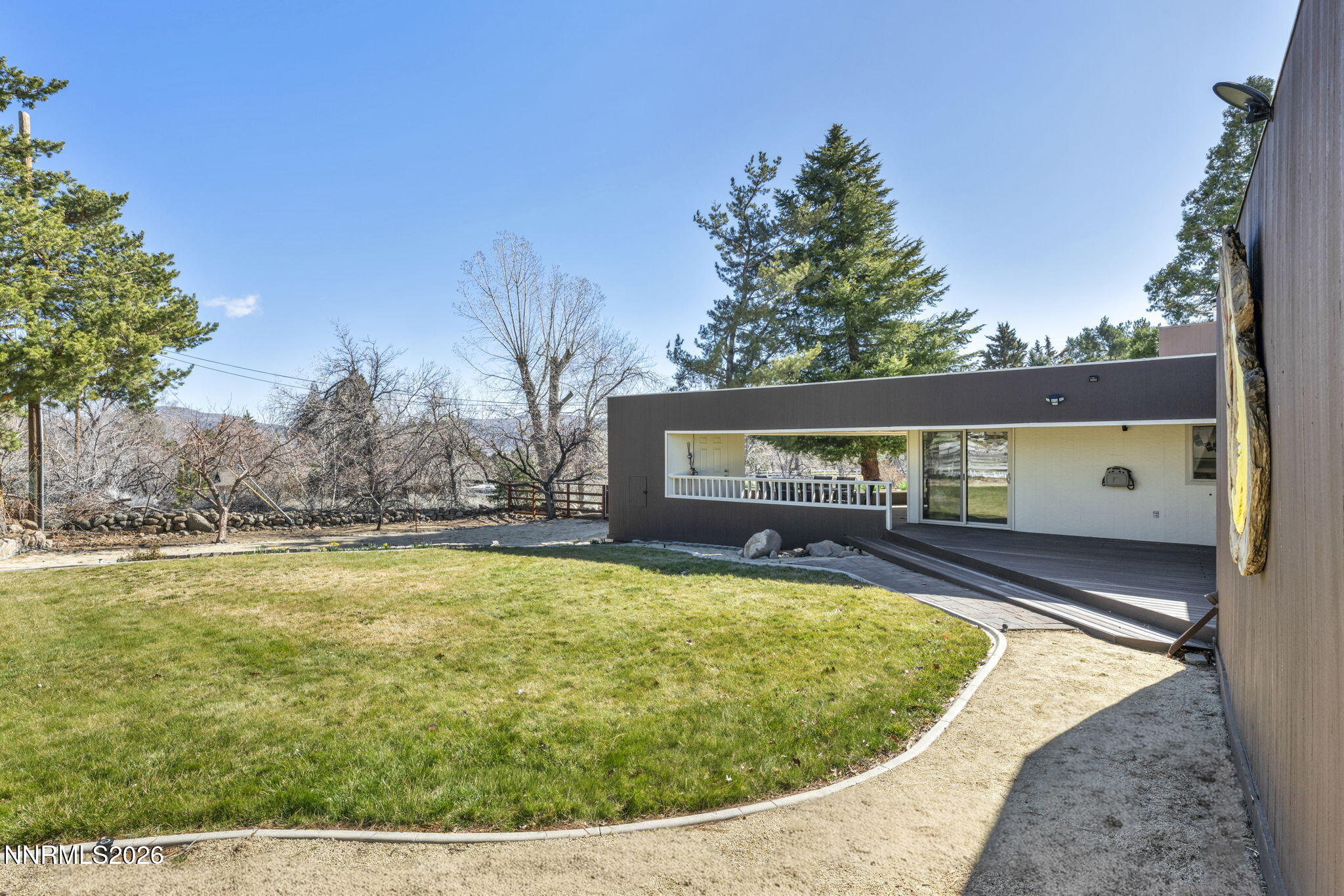 13600 Stoneybrook Drive Reno, NV 89511 - Photo 3 of 120 a view of a house with pool and trees in the background
