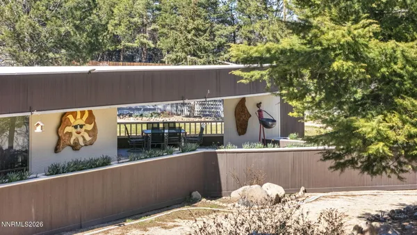 a view of a kitchen with kitchen island granite countertop lots of counter top space