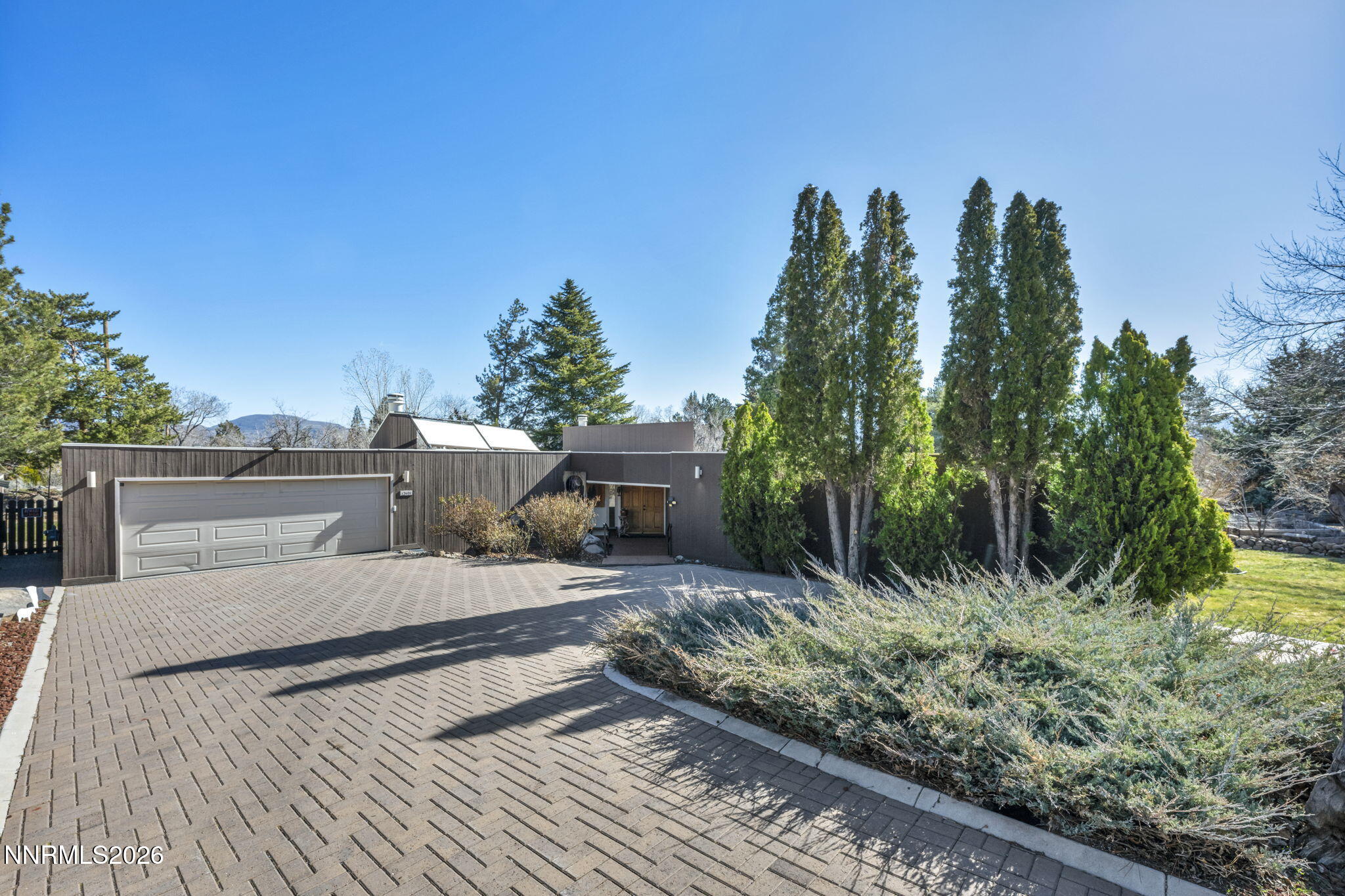 13600 Stoneybrook Drive Reno, NV 89511 - Photo 45 of 120 a view of a backyard with plants and a patio