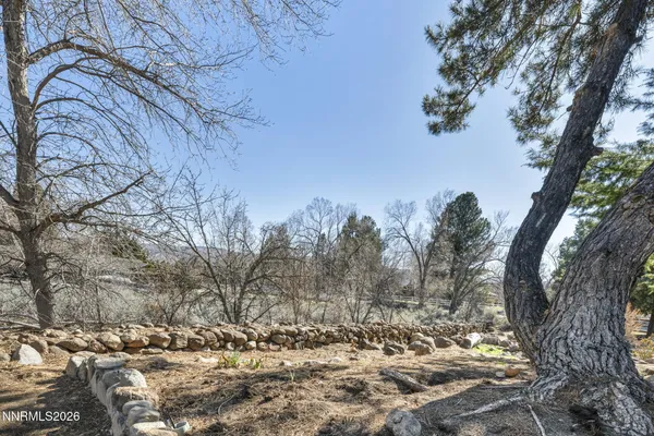 a bathroom with a granite countertop sink and mirror
