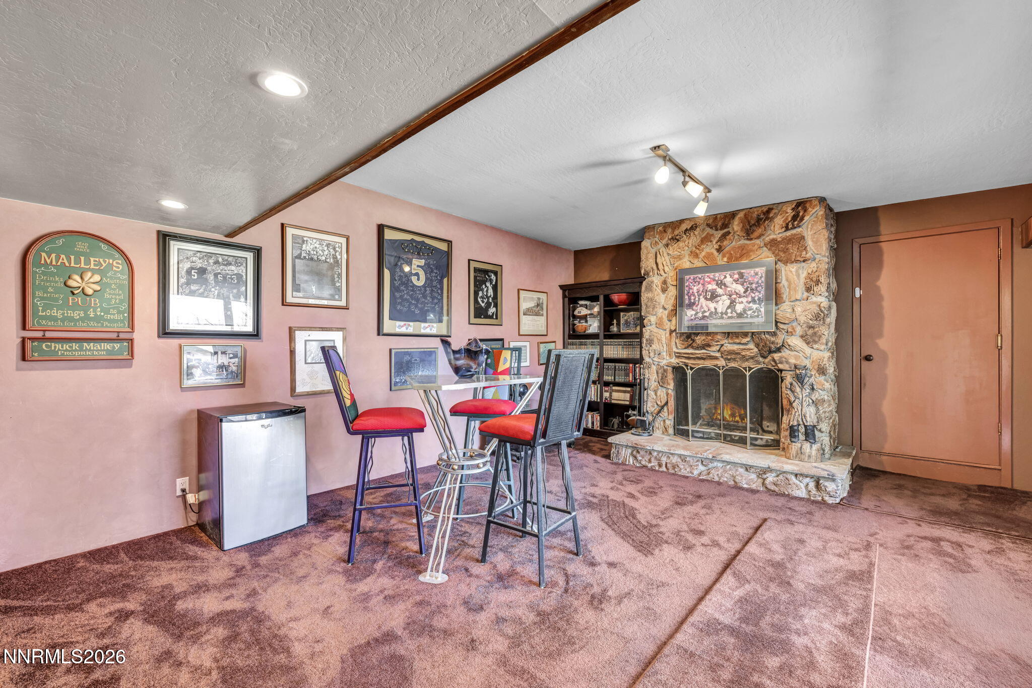 13600 Stoneybrook Drive Reno, NV 89511 - Photo 75 of 120 a living room with furniture a flat screen tv and a table