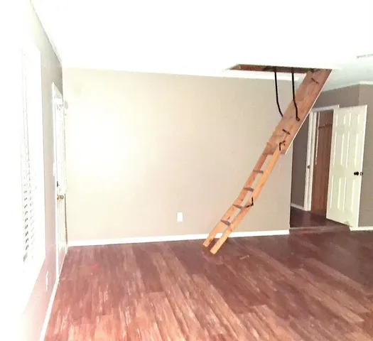 a view of entryway with wooden floor