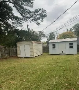 a view of a yard in front of a house