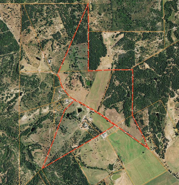 an aerial view of a residential houses with outdoor space