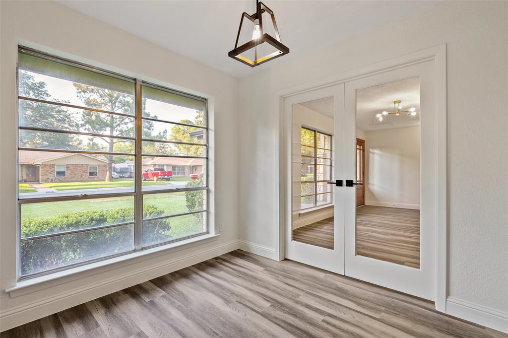 3126 Jubilee Trail Dallas, TX 75229 - Photo 10 of 38 a view of empty room with wooden floor and windows