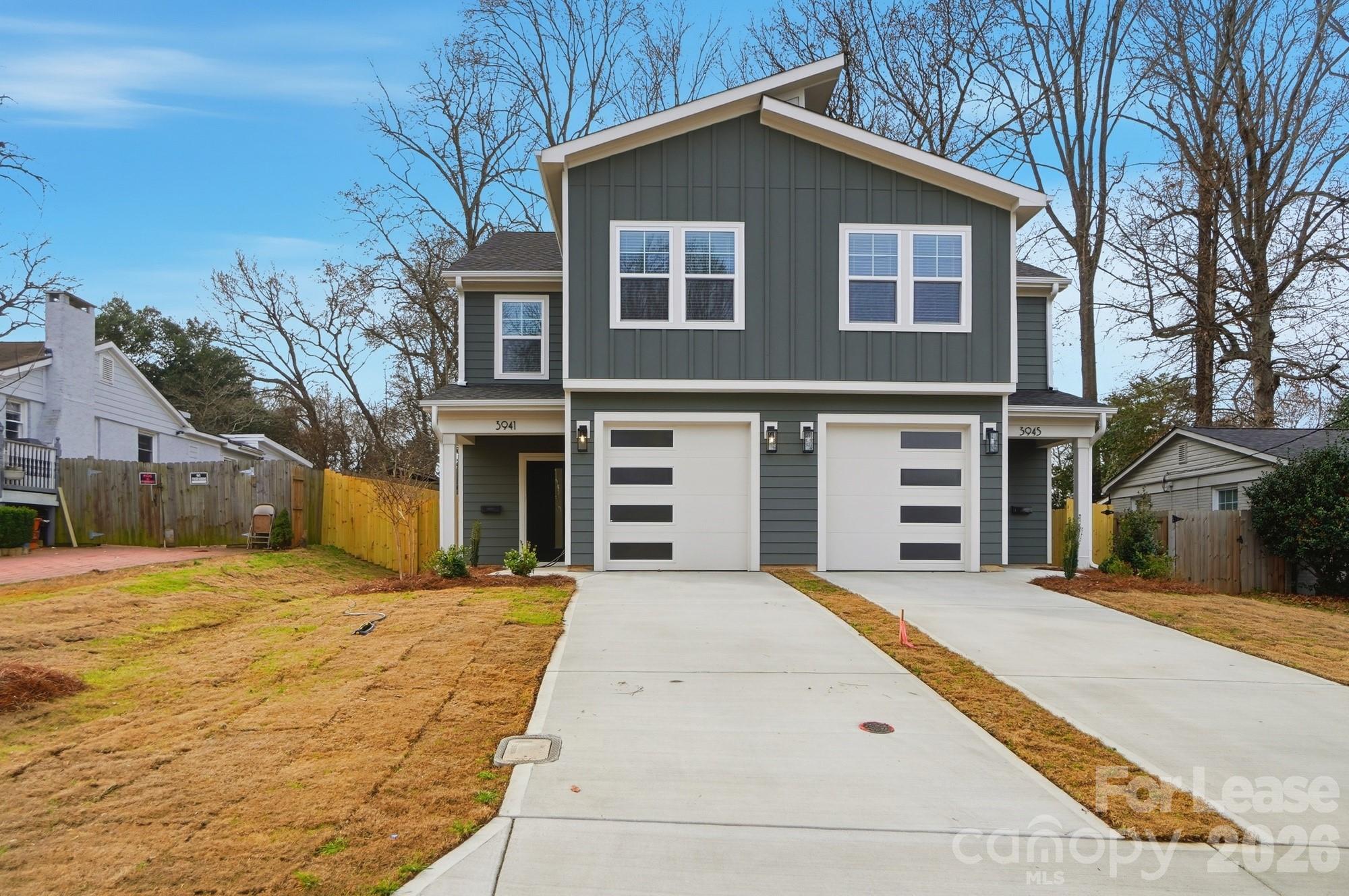 3941 Tillman Road Charlotte, NC 28208 - Photo 1 of 48 a view of house with yard and trees in the background