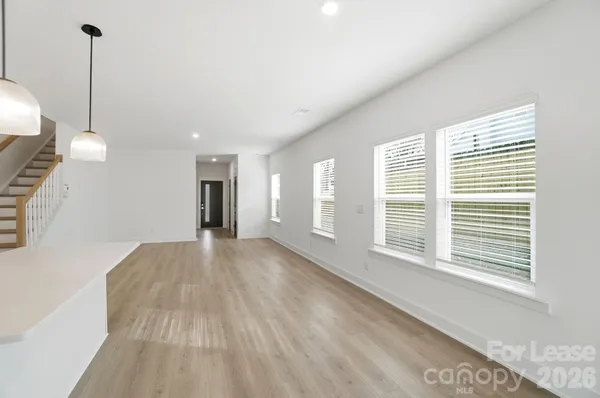 a kitchen with sink cabinets and wooden floor