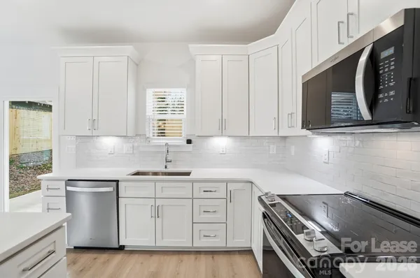 a view of kitchen with wooden floor