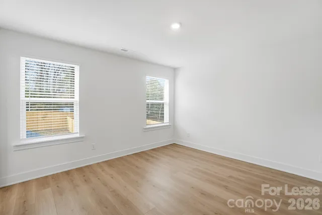 a view of an empty room with a closet