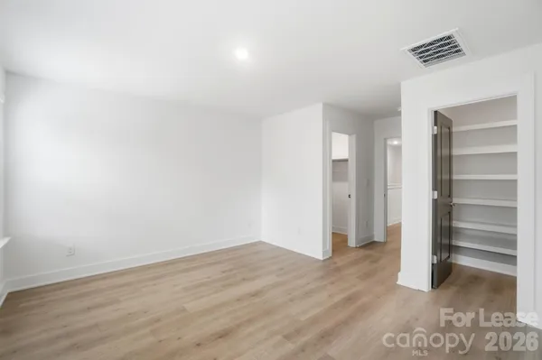 a bathroom with a double vanity sink and mirror
