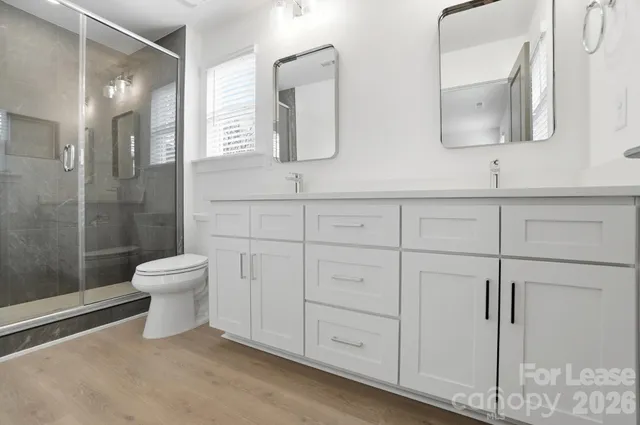 a bathroom with a shower and toilet