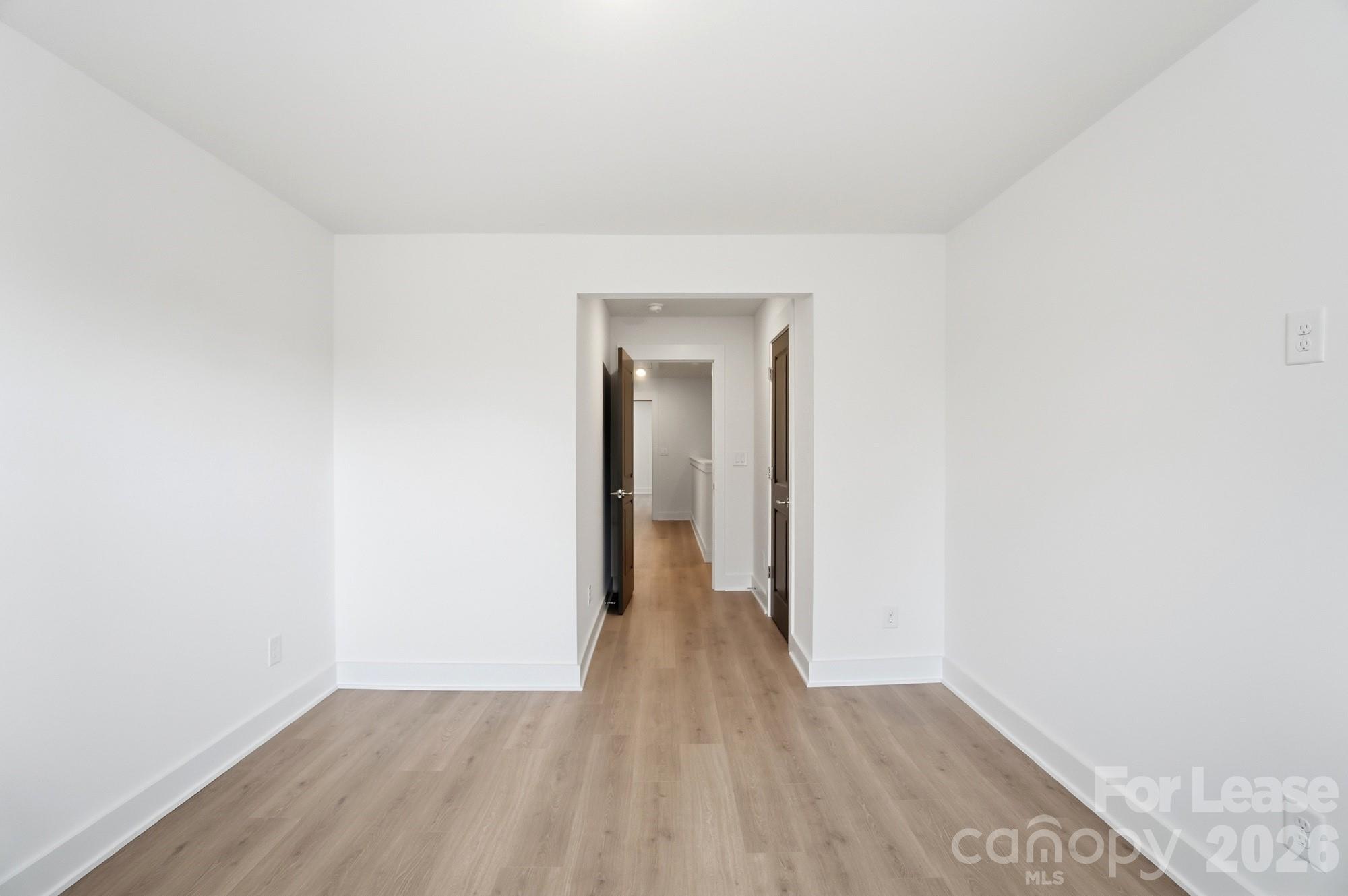 3941 Tillman Road Charlotte, NC 28208 - Photo 38 of 48 a view of an empty room with wooden floor