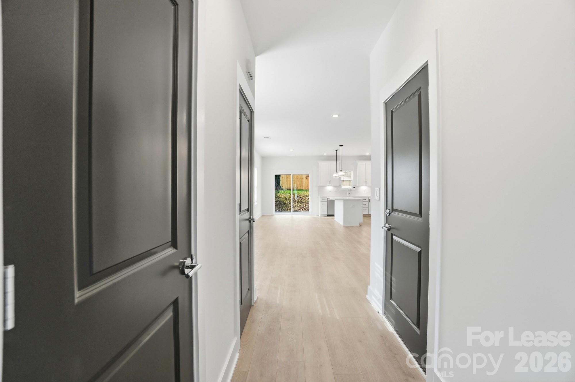 3941 Tillman Road Charlotte, NC 28208 - Photo 4 of 48 a view of a hallway with wooden floor