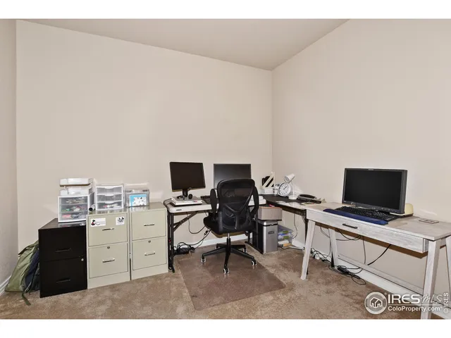 a view of a workspace with furniture