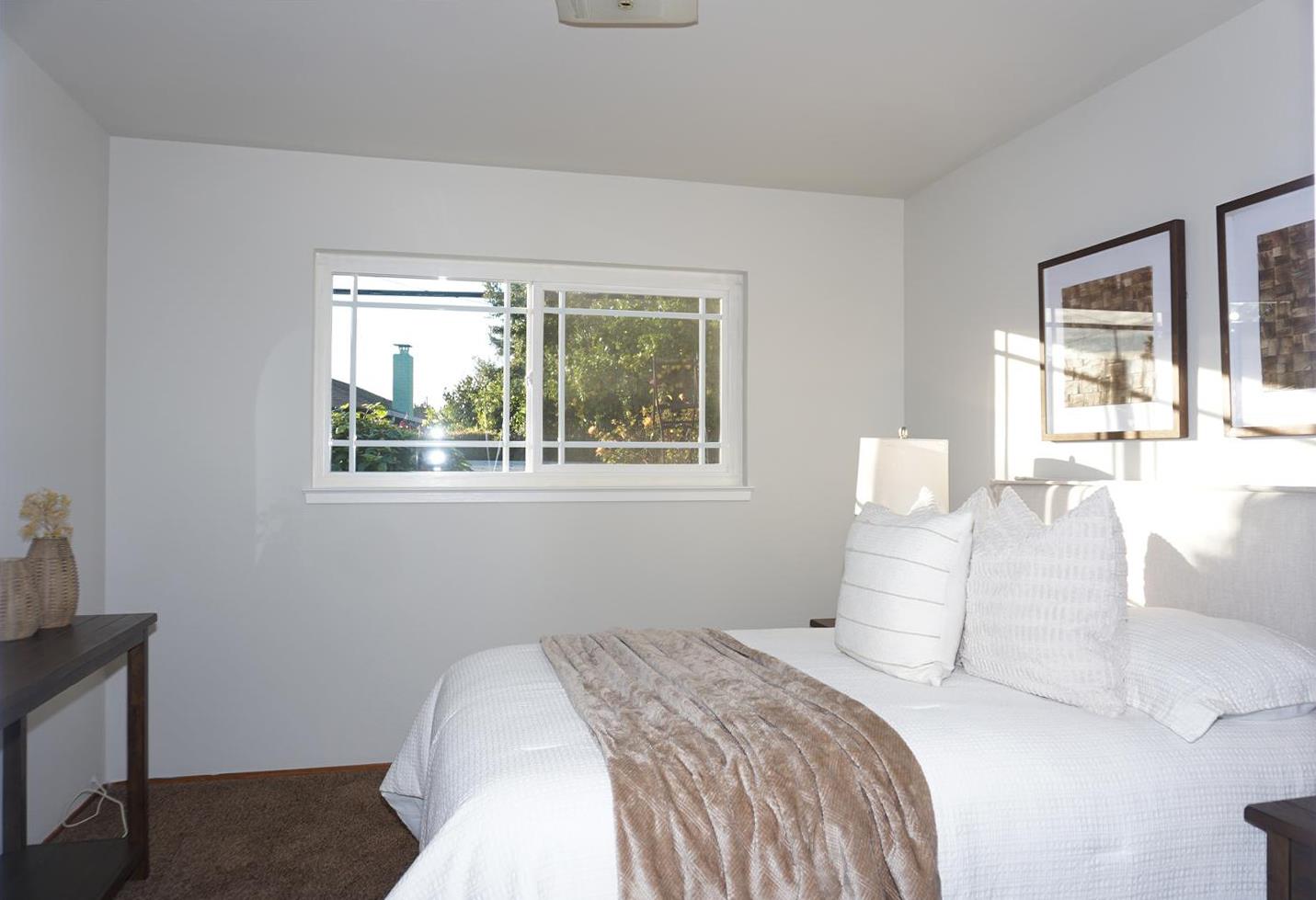 580 Pomeroy Avenue Santa Clara, CA 95051 - Photo 11 of 15 a bedroom with a bed and a window