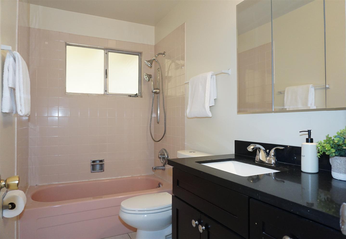 580 Pomeroy Avenue Santa Clara, CA 95051 - Photo 12 of 15 a bathroom with a granite countertop sink toilet and shower