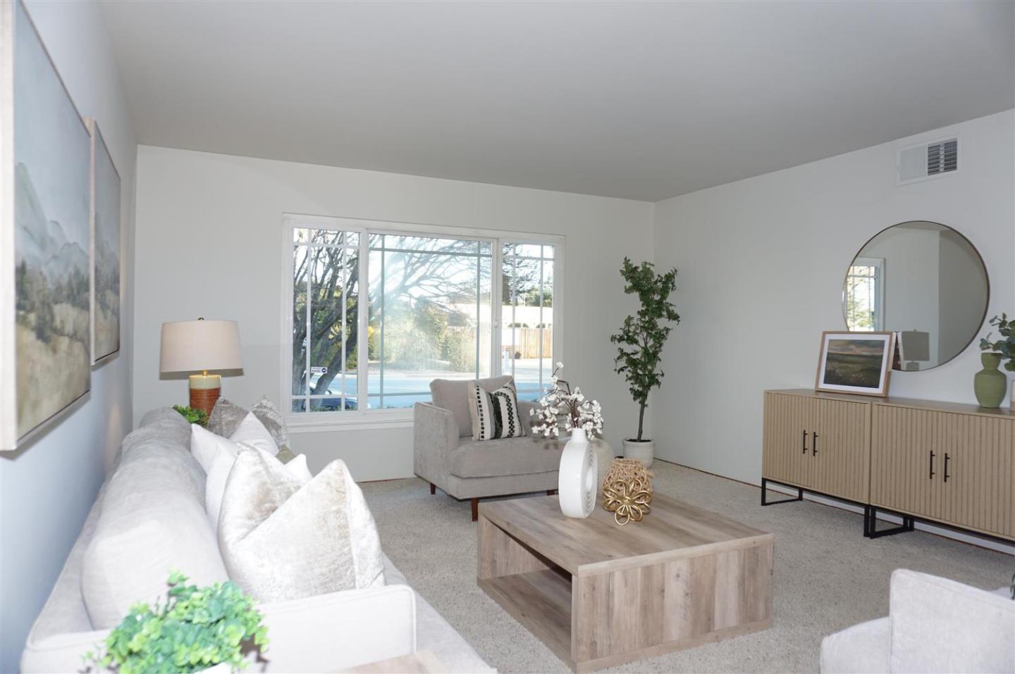 580 Pomeroy Avenue Santa Clara, CA 95051 - Photo 3 of 15 a living room with furniture and a large window