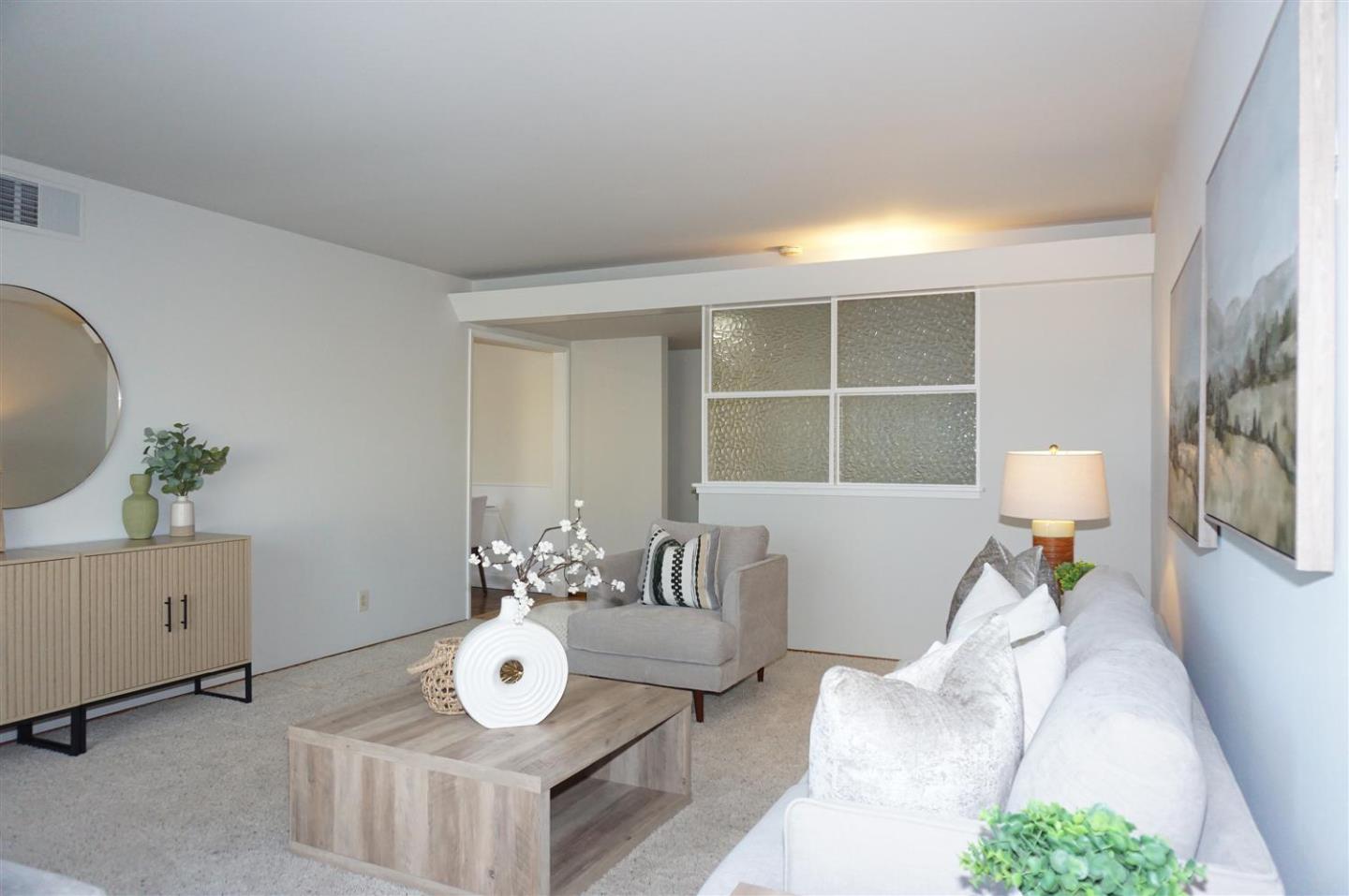 580 Pomeroy Avenue Santa Clara, CA 95051 - Photo 4 of 15 a living room with furniture and a window