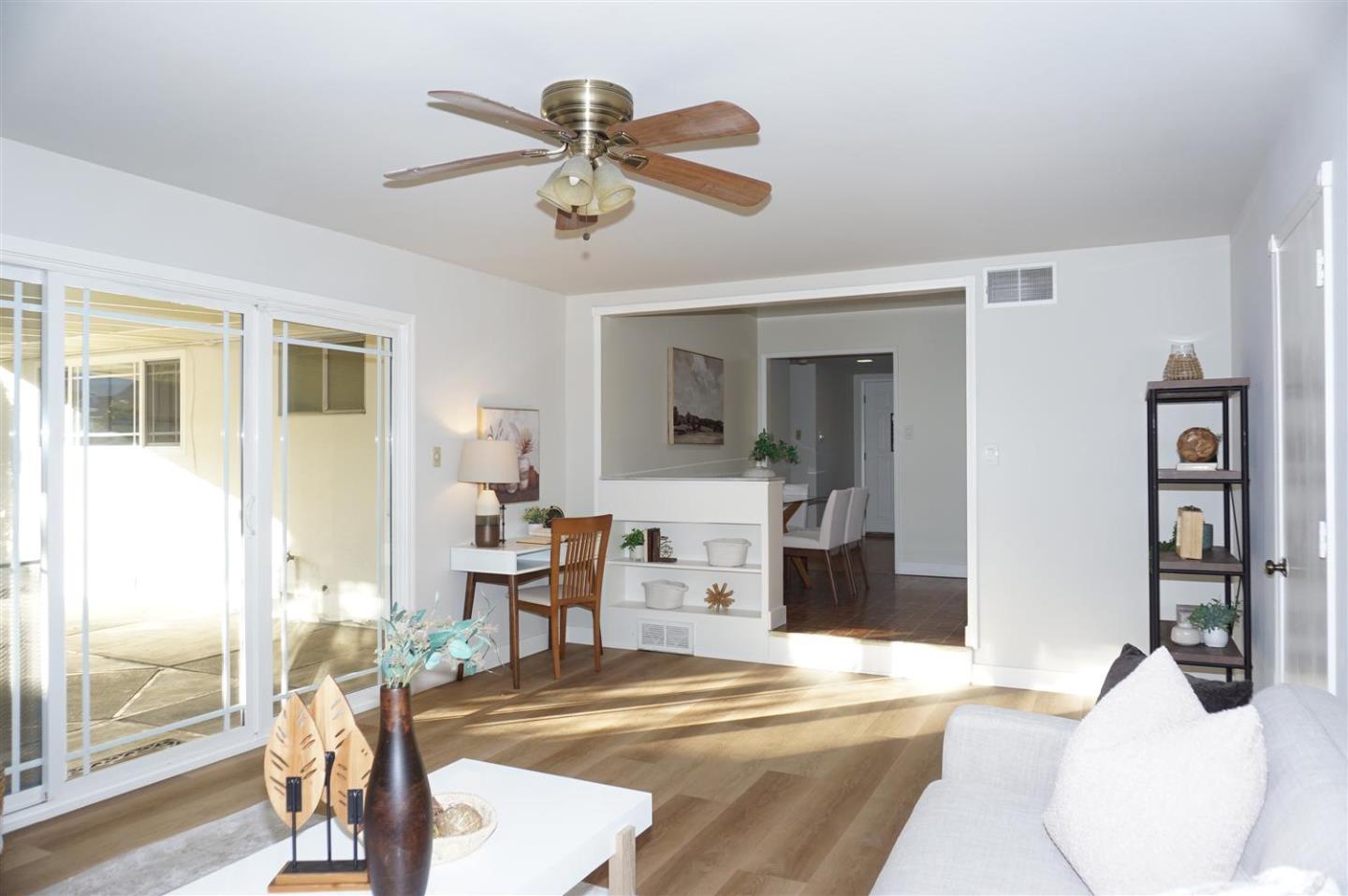 580 Pomeroy Avenue Santa Clara, CA 95051 - Photo 7 of 15 a bedroom with a bed and a chandelier