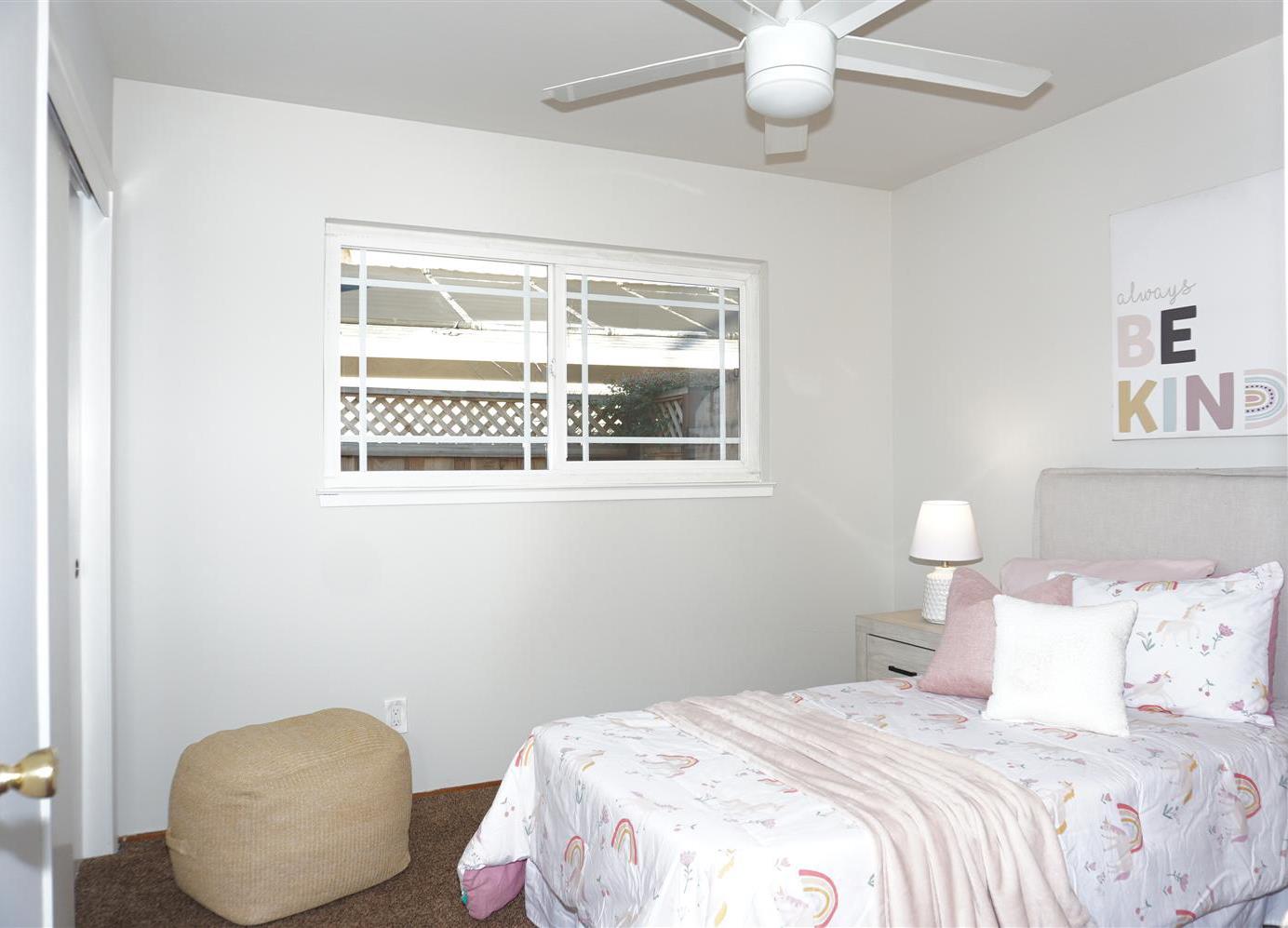 580 Pomeroy Avenue Santa Clara, CA 95051 - Photo 10 of 15 a bedroom with a bed and a painting on the wall