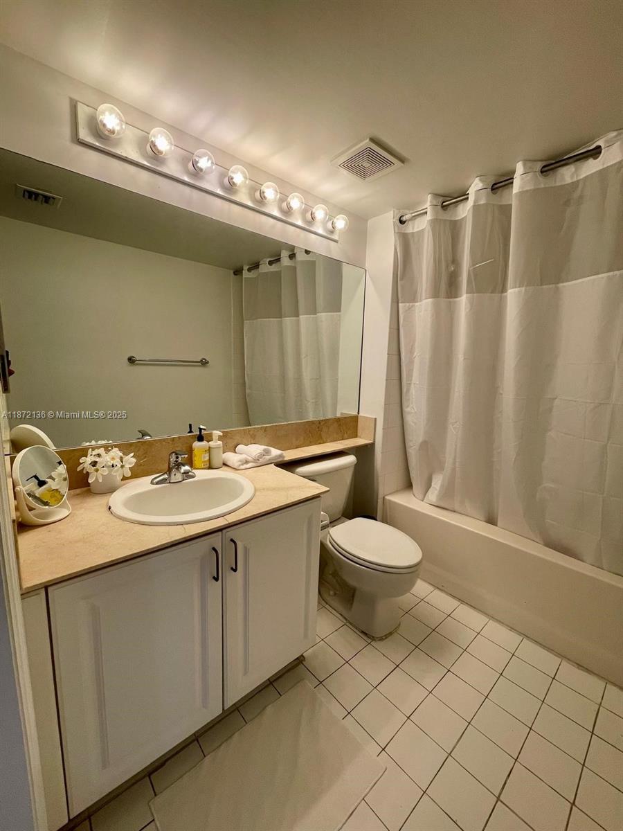 1155 Brickell Bay Drive, Unit 1805 Miami, FL 33131 - Photo 10 of 11 a bathroom with a sink toilet and shower