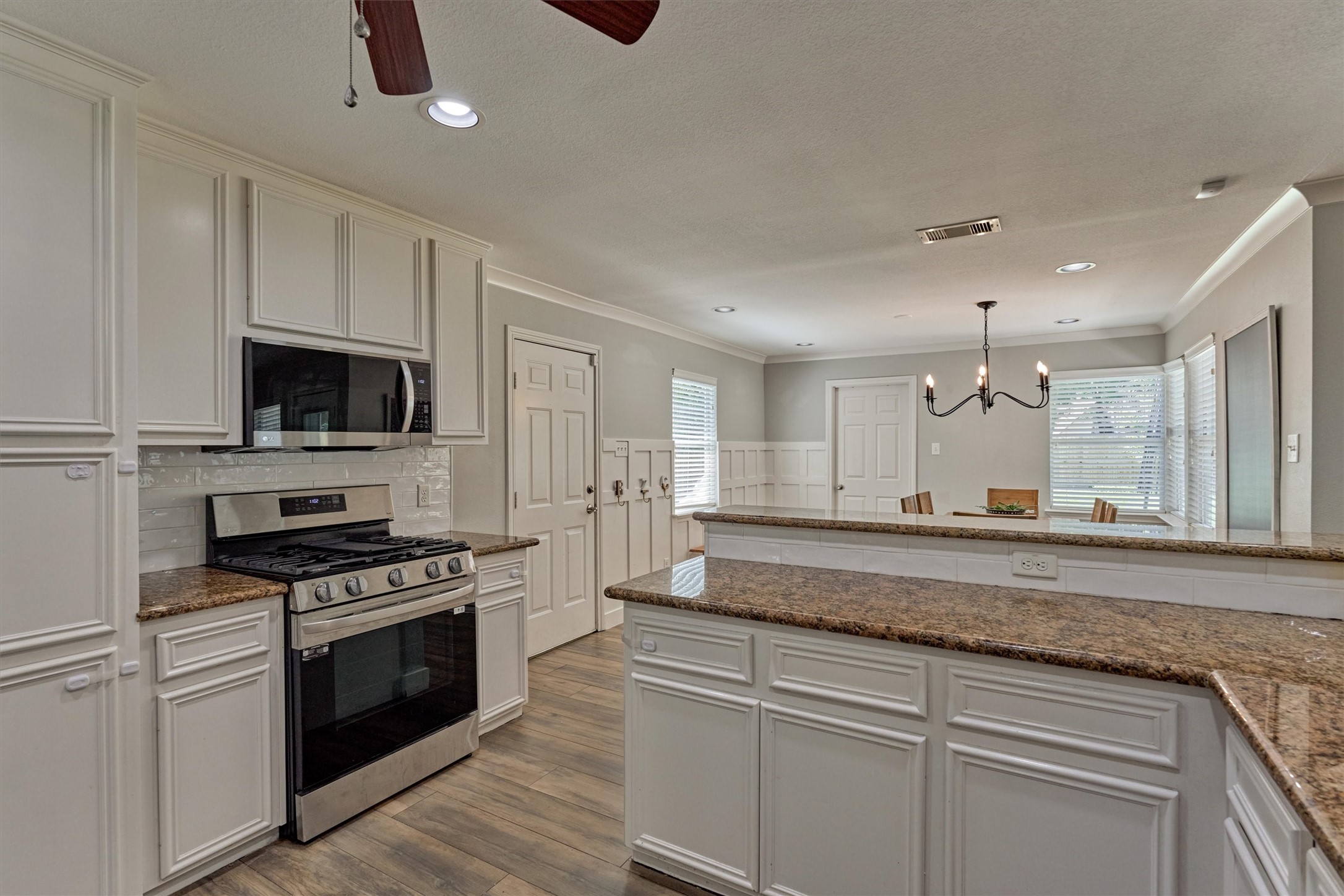 6515 Glenhill Drive Spring, TX 77389 - Photo 12 of 39 a kitchen with stainless steel appliances granite countertop a stove and a sink