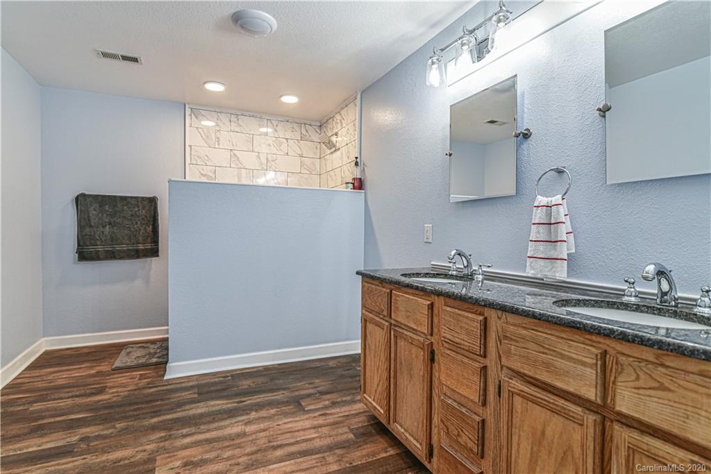 90 Devlin Street Canton, NC 28716 - Photo 20 of 25 a kitchen with granite countertop a sink and cabinets