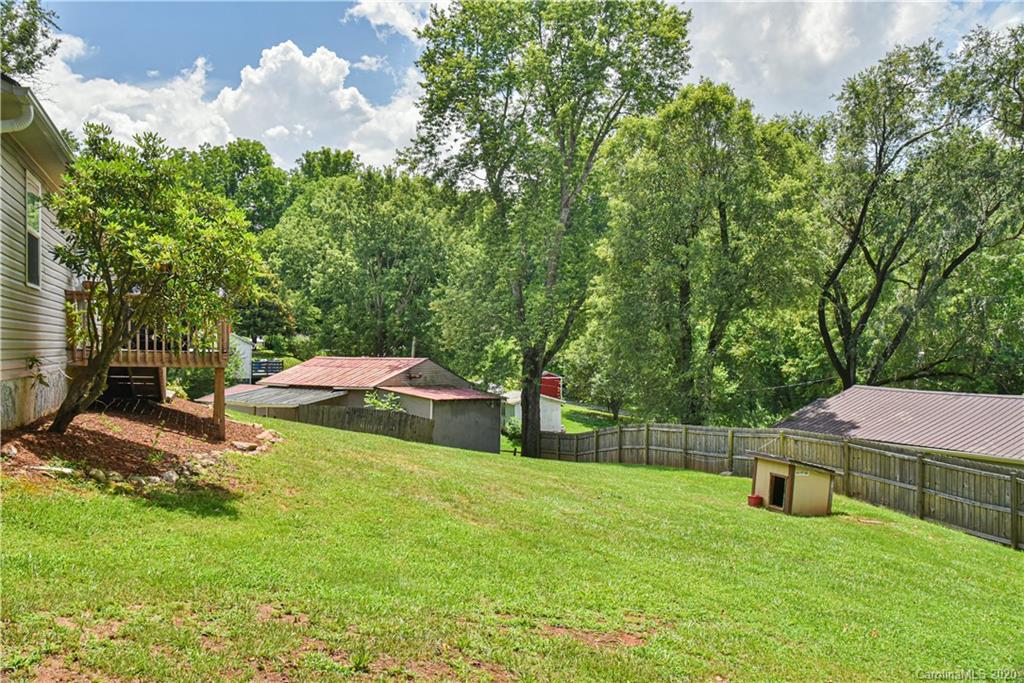 90 Devlin Street Canton, NC 28716 - Photo 5 of 25 a backyard of a house with table and chairs