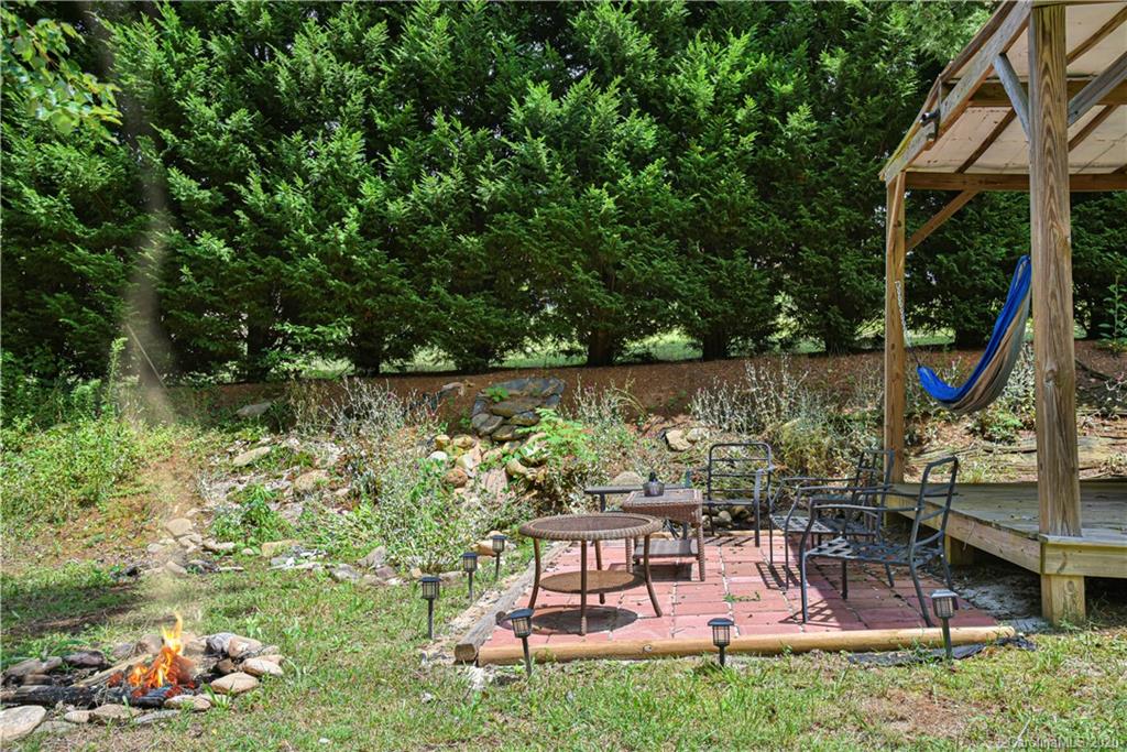 90 Devlin Street Canton, NC 28716 - Photo 6 of 25 a view of a chairs and table in the garden