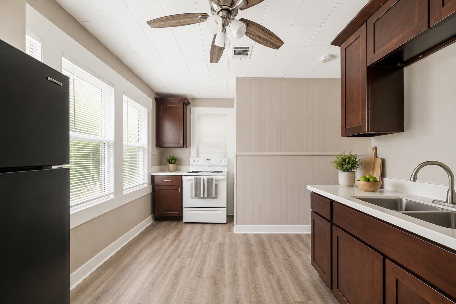 1302 20th Street Huntsville, TX 77340 - Photo 12 of 26 a kitchen with a refrigerator wooden floor and a sink