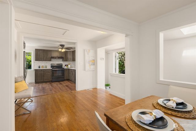 a kitchen with stainless steel appliances kitchen island granite countertop a sink and cabinets
