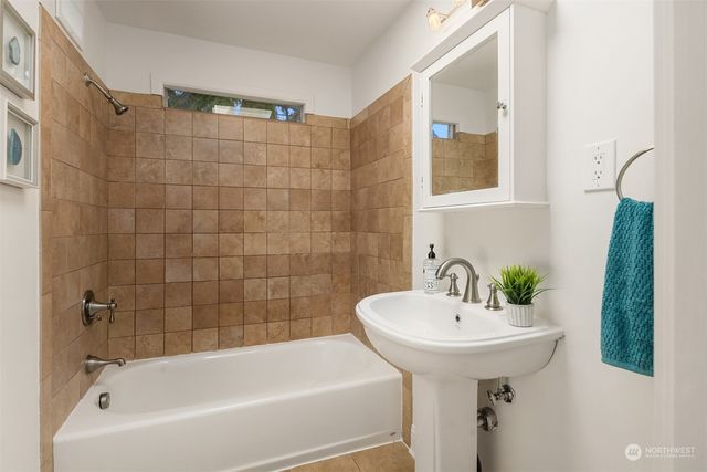 a bathroom with a sink and a bathtub