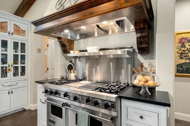 a spacious bedroom with a bed couch and a window
