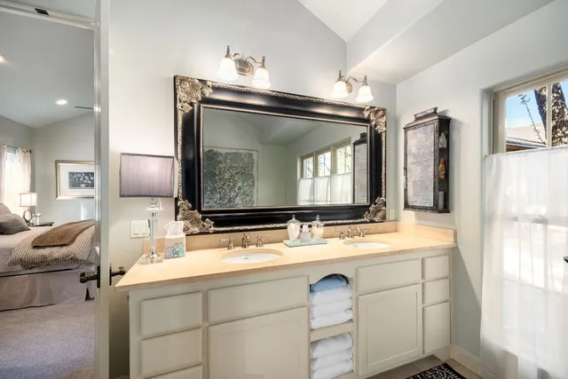 a view of a house with a patio and a yard